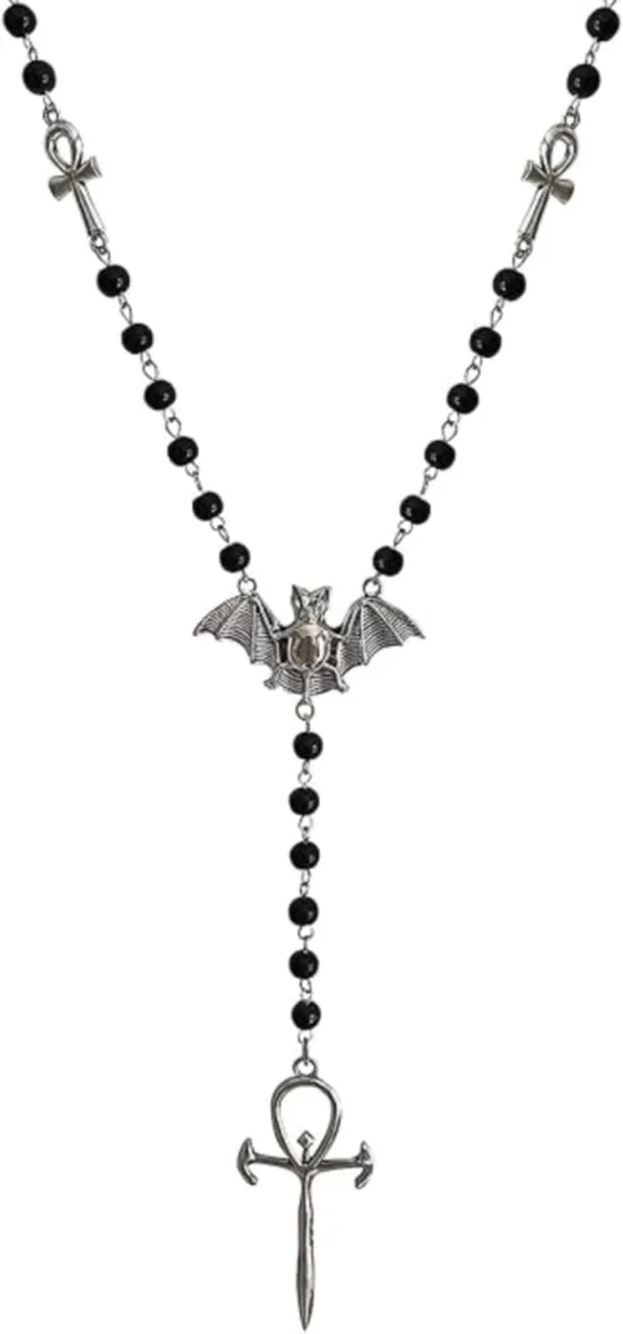 Long black beaded rosary-style necklace with alternating skull and bead sections, ending in a large ankh cross pendant flanked by outstretched bat wings, in a matte black gothic finish
