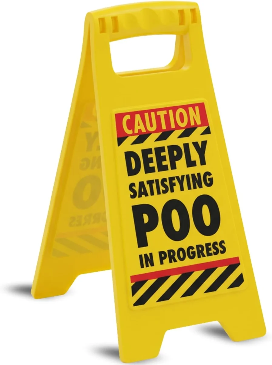Novelty bathroom warning sign with poo in progress message