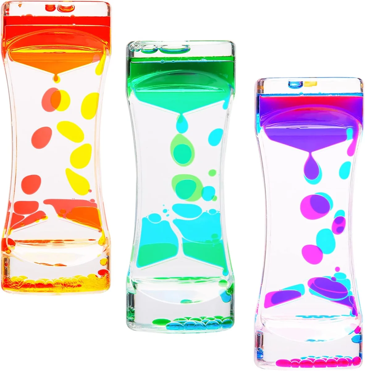 Set of three colorful liquid motion bubbler desk toys shaped like small hourglass tubes, each filled with two immiscible colored liquids that slowly drip and ooze past each other for a mesmerizing sensory and fidget effect