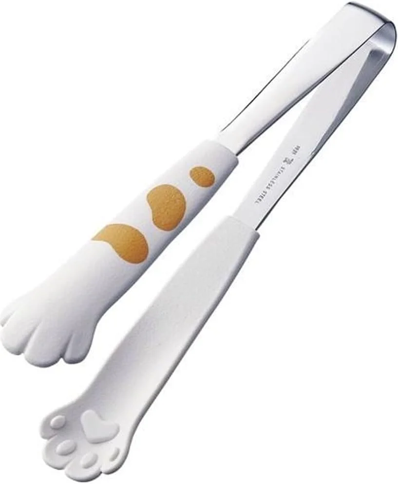 White ceramic cat tongs with cat head forming the pinching mechanism