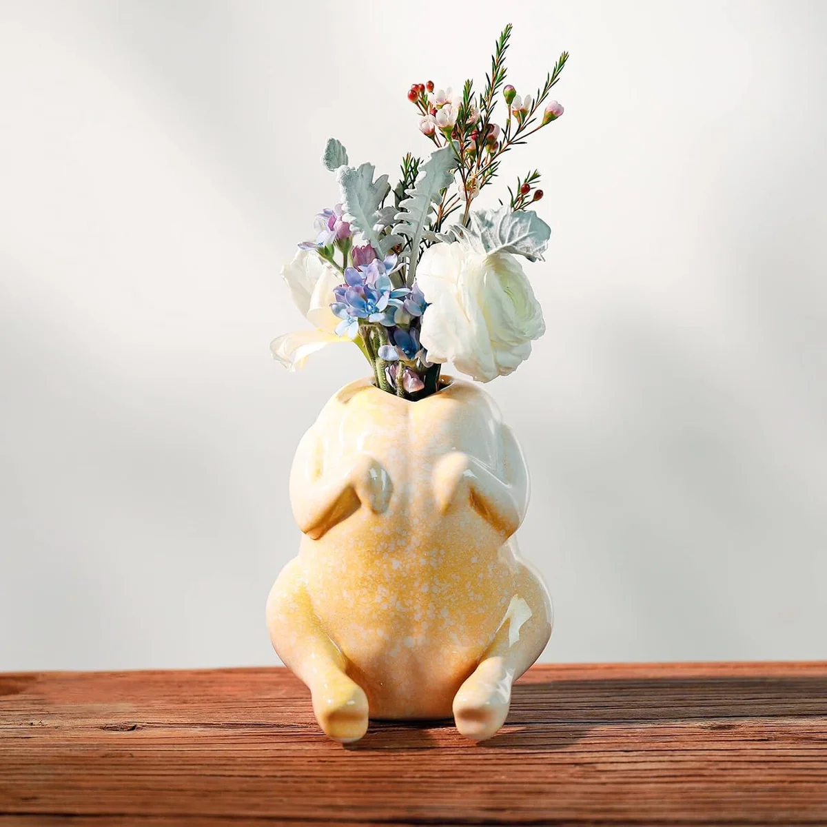 Yellow ceramic planter shaped like a raw chicken