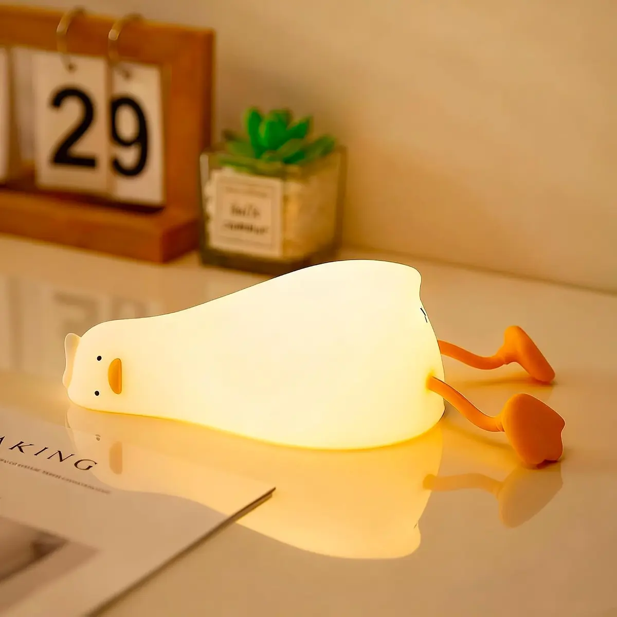 Duck-shaped novelty night light lying on its side