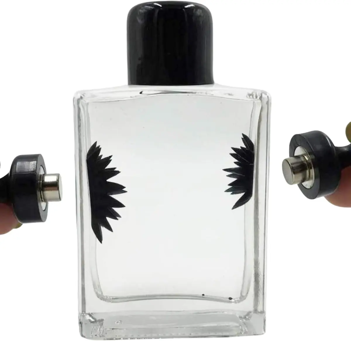 Sealed bottle of black ferrofluid liquid with two magnets