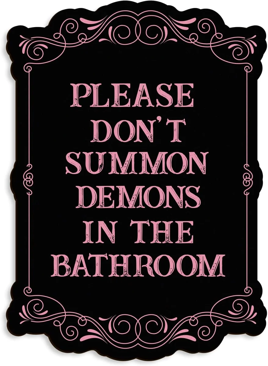Wooden wall sign with gothic lettering reading 'Please Do Not Summon Demons in the Bathroom'
