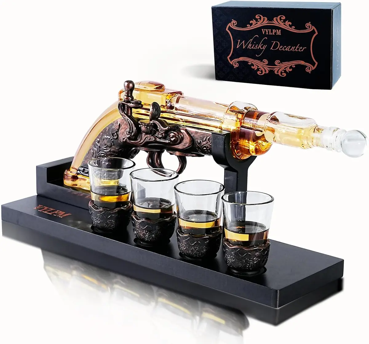 Whiskey decanter shaped like a revolver with four shot glasses