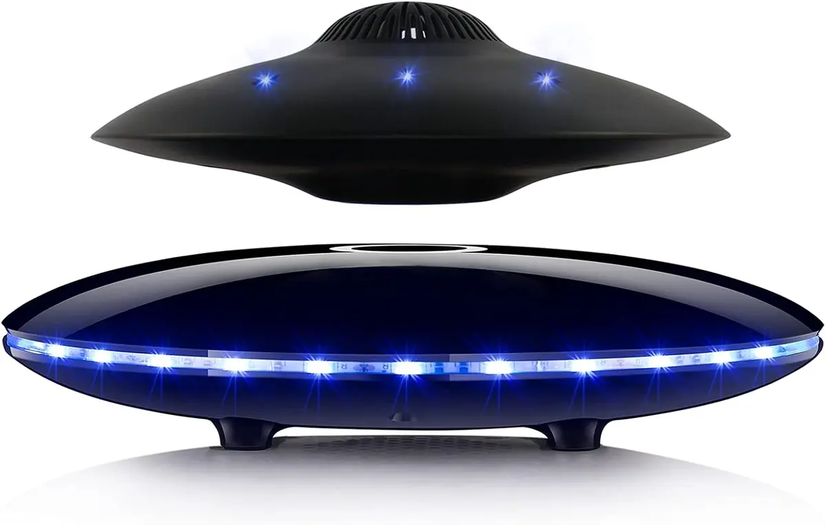 Bluetooth speaker levitating above its base with LED lights