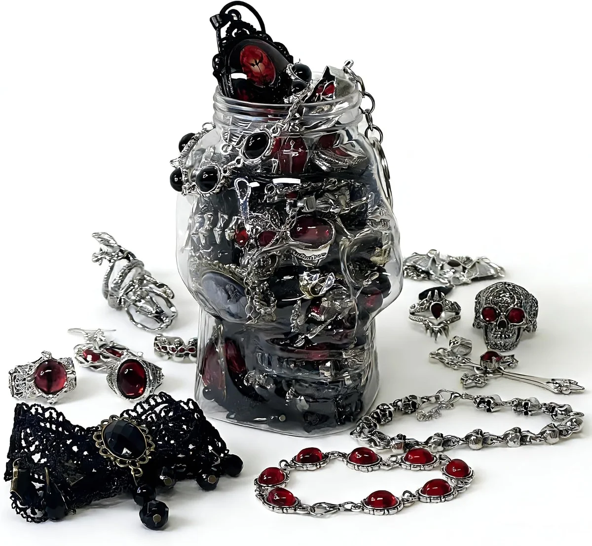 Assorted mystery gift set of gothic and witchy costume jewelry including mixed silver-tone and black necklaces, chunky rings, hoop and drop earrings, and bracelets or bangles arranged together as a grab-bag lot