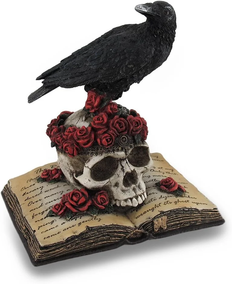 Hand-painted resin statue of a black raven perched on a rose-covered skull
