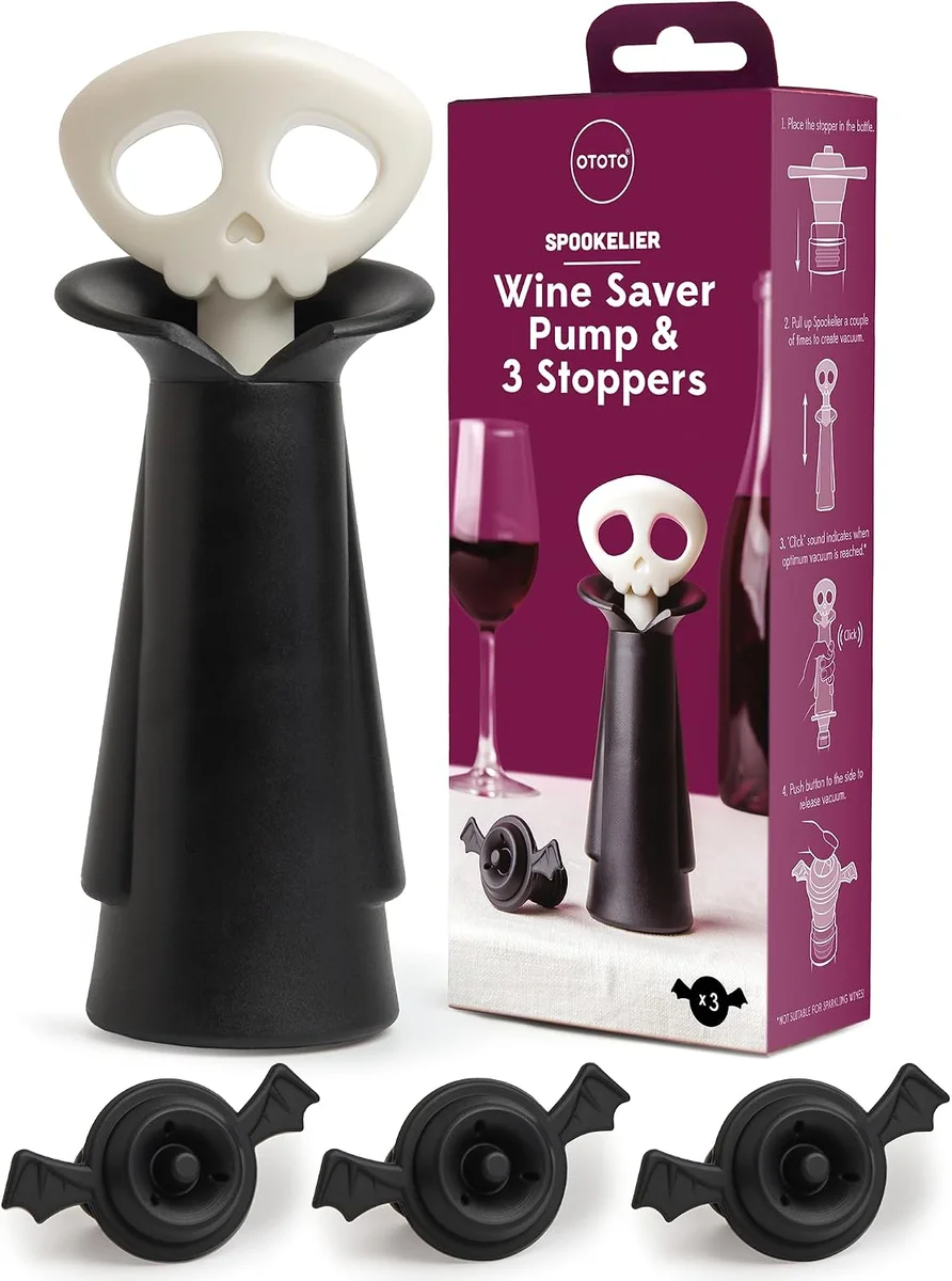 Skull-shaped wine pump and stoppers, dark plastic with gothic design detail