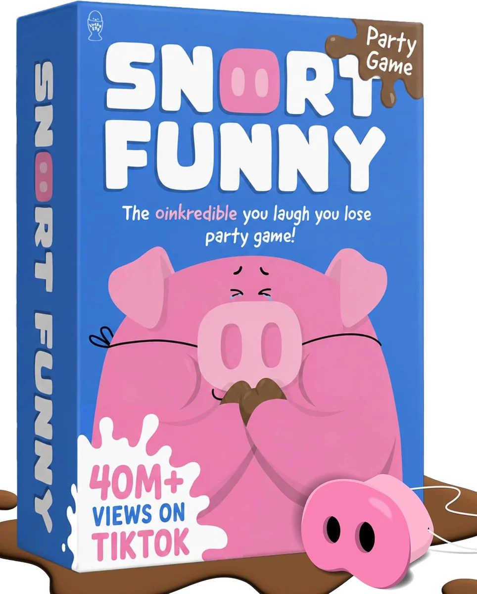 Snort Funny party game box featuring a cartoon pink pig laughing on a bright yellow background, with the game title in bold red lettering and 150 challenge cards fanned out below