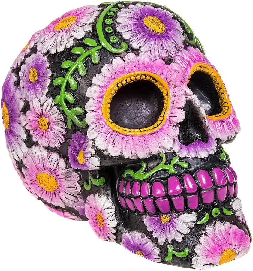 Pale pink resin skull with decorative detailing