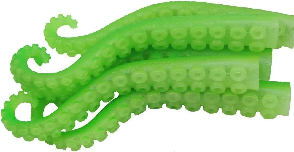 Set of five green rubber finger puppets with tentacle appendages, designed to glow in the dark