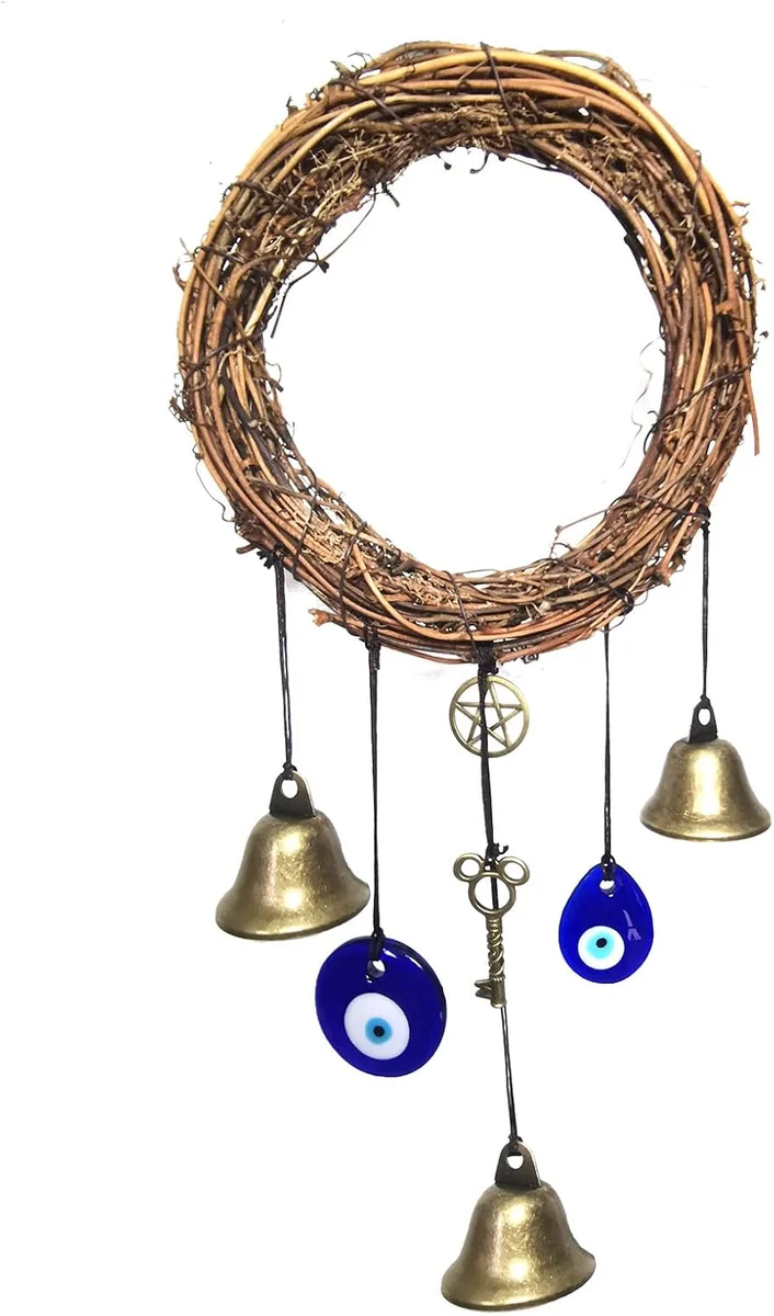 Cluster of small brass witch bells strung on a braided cord with blue glass evil-eye beads and tassels, designed to hang from a door knob as a Wiccan protection charm for home and garden
